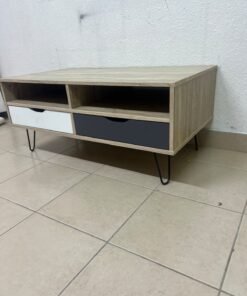 The "Maxton" coffee table from Home Center features a wood-effect finish, slender black hairpin legs, and two contrasting drawers.