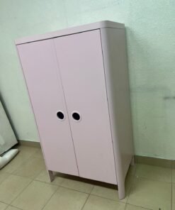 The "Busunge" children's wardrobe from IKEA comes in light pink and features rounded corners and distinctive circular cutouts that serve as handles. - Image 10