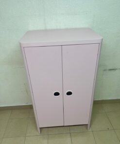 The "Busunge" children's wardrobe from IKEA comes in light pink and features rounded corners and distinctive circular cutouts that serve as handles. - Image 13