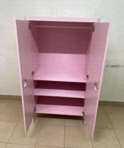 The "Busunge" children's wardrobe from IKEA comes in light pink and features rounded corners and distinctive circular cutouts that serve as handles. - Image 3