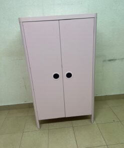 The "Busunge" children's wardrobe from IKEA comes in light pink and features rounded corners and distinctive circular cutouts that serve as handles. - Image 5