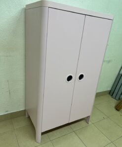The "Busunge" children's wardrobe from IKEA comes in light pink and features rounded corners and distinctive circular cutouts that serve as handles. - Image 8