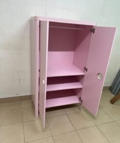 The "Busunge" children's wardrobe from IKEA comes in light pink and features rounded corners and distinctive circular cutouts that serve as handles. - Image 11