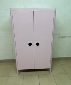 The "Busunge" children's wardrobe from IKEA comes in light pink and features rounded corners and distinctive circular cutouts that serve as handles. - Image 12