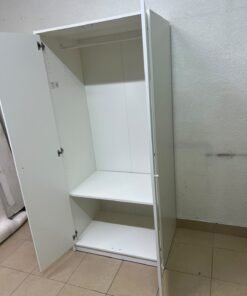 The IKEA KLEPPSTAD white two-door wardrobe features a simple design with two round handles and dimensions of 79x55x176 cm. - Image 6