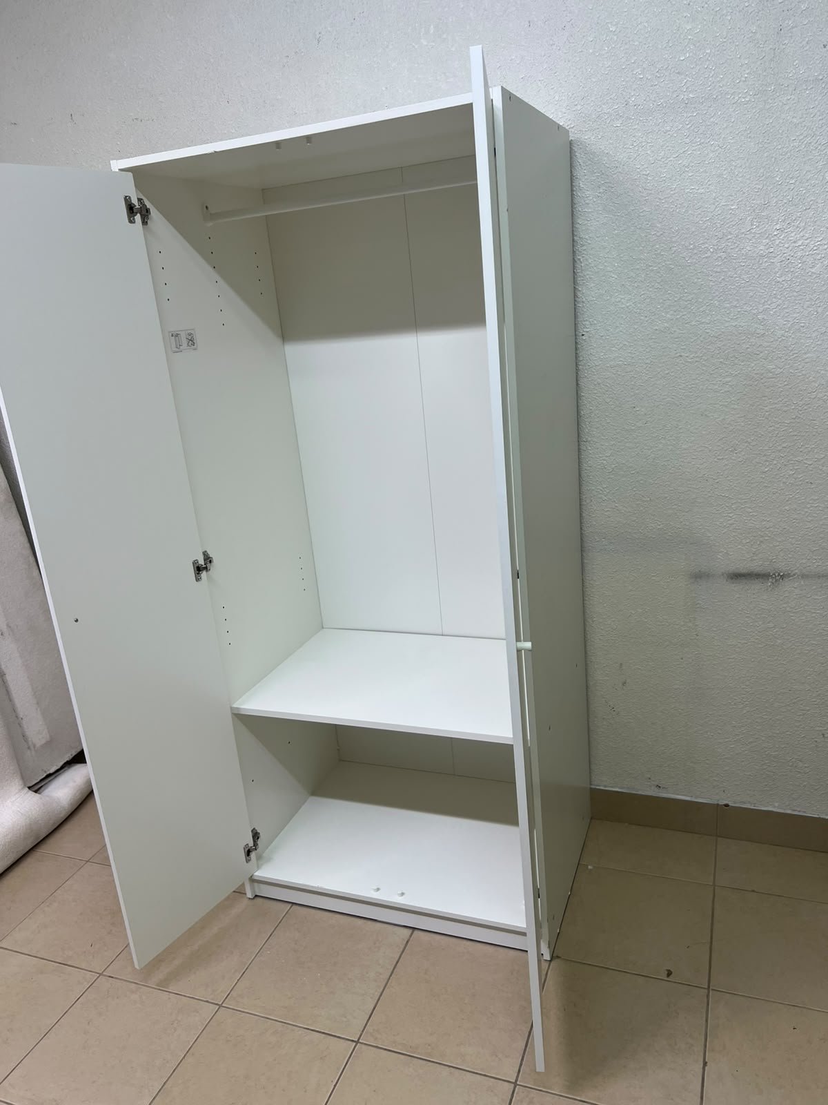 The IKEA KLEPPSTAD white two-door wardrobe features a simple design with two round handles and dimensions of 79x55x176 cm. - Image 6