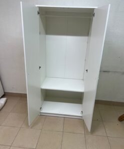 The IKEA KLEPPSTAD white two-door wardrobe features a simple design with two round handles and dimensions of 79x55x176 cm. - Image 5