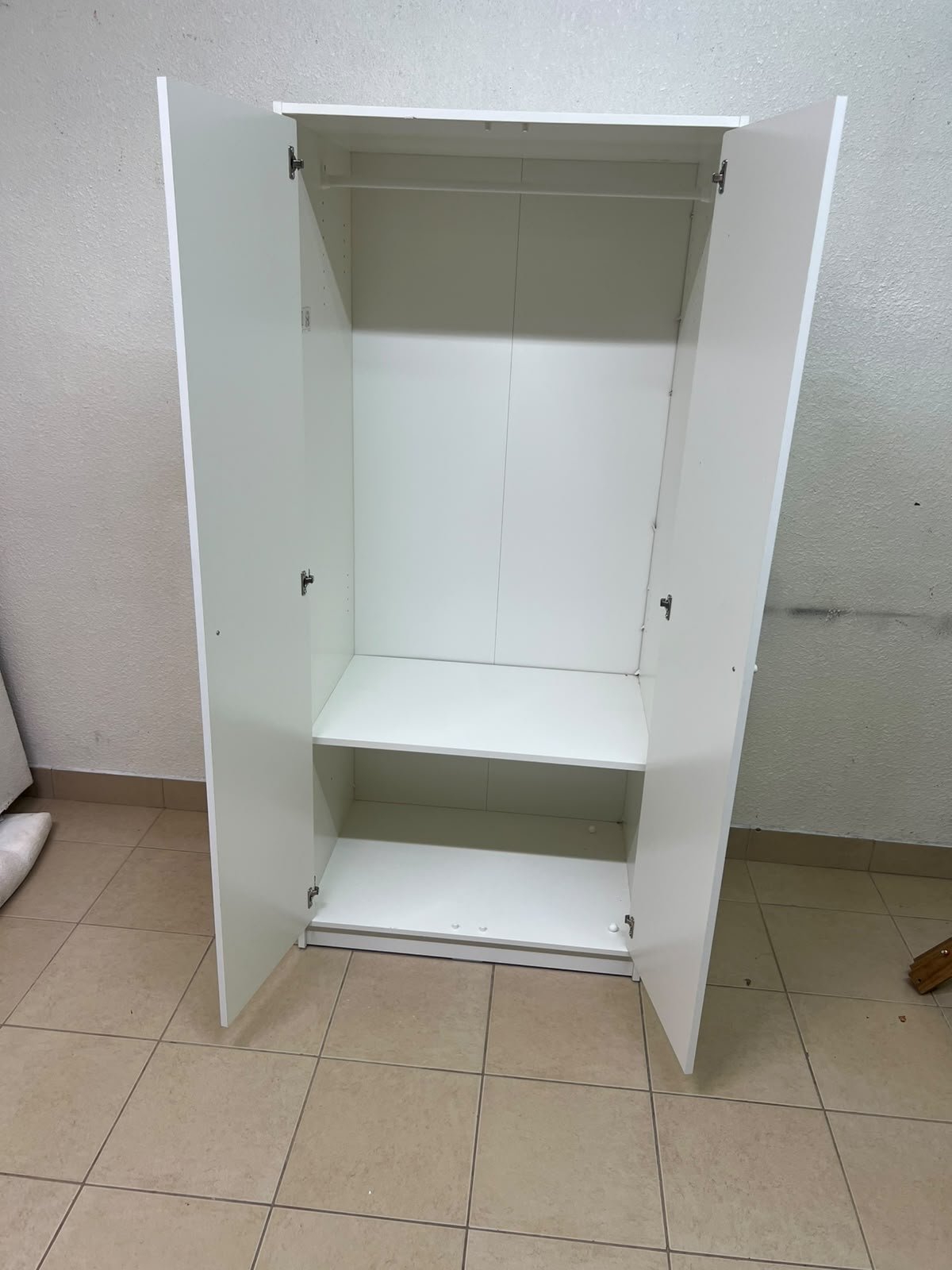 The IKEA KLEPPSTAD white two-door wardrobe features a simple design with two round handles and dimensions of 79x55x176 cm. - Image 5