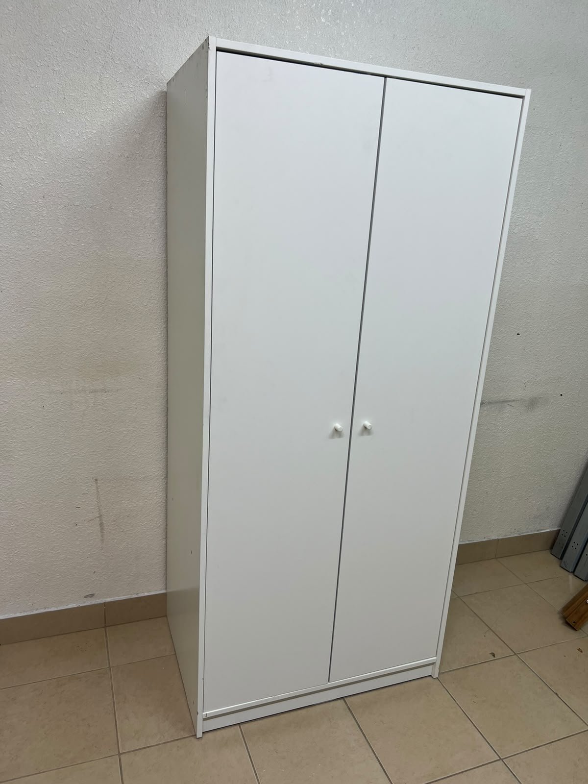 The IKEA KLEPPSTAD white two-door wardrobe features a simple design with two round handles and dimensions of 79x55x176 cm. - Image 7