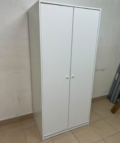 The IKEA KLEPPSTAD white two-door wardrobe features a simple design with two round handles and dimensions of 79x55x176 cm.