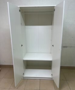 The IKEA KLEPPSTAD white two-door wardrobe features a simple design with two round handles and dimensions of 79x55x176 cm. - Image 9