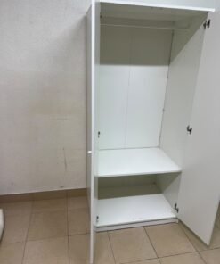 The IKEA KLEPPSTAD white two-door wardrobe features a simple design with two round handles and dimensions of 79x55x176 cm. - Image 12
