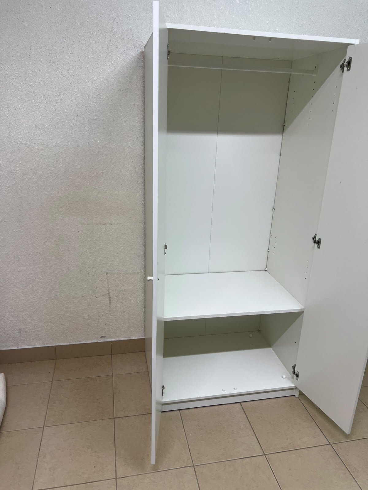The IKEA KLEPPSTAD white two-door wardrobe features a simple design with two round handles and dimensions of 79x55x176 cm. - Image 12