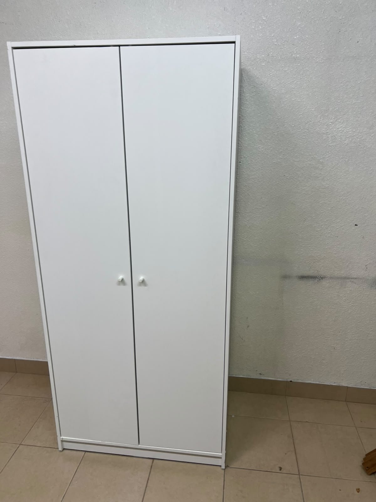 The IKEA KLEPPSTAD white two-door wardrobe features a simple design with two round handles and dimensions of 79x55x176 cm. - Image 13