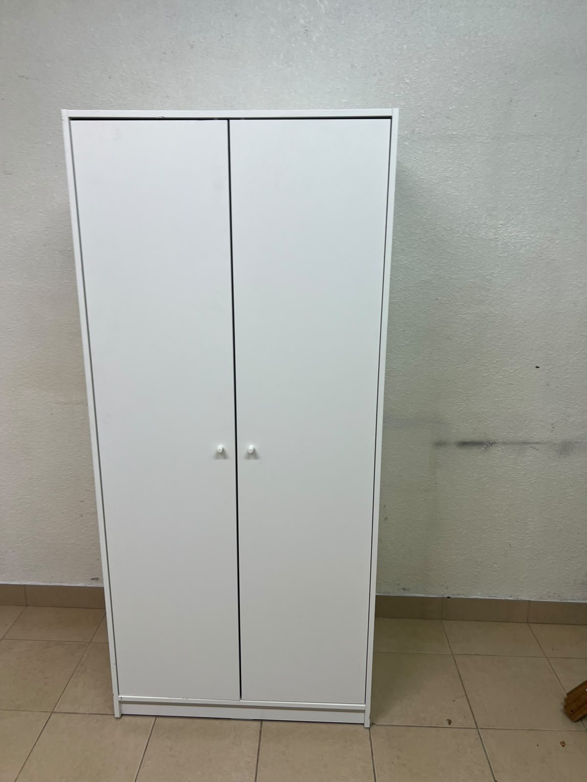 The IKEA KLEPPSTAD white two-door wardrobe features a simple design with two round handles and dimensions of 79x55x176 cm. - Image 14