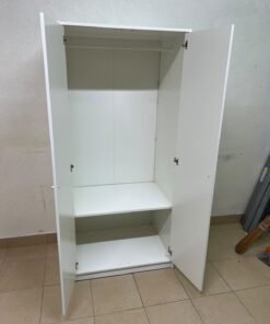 The IKEA KLEPPSTAD white two-door wardrobe features a simple design with two round handles and dimensions of 79x55x176 cm. - Image 2