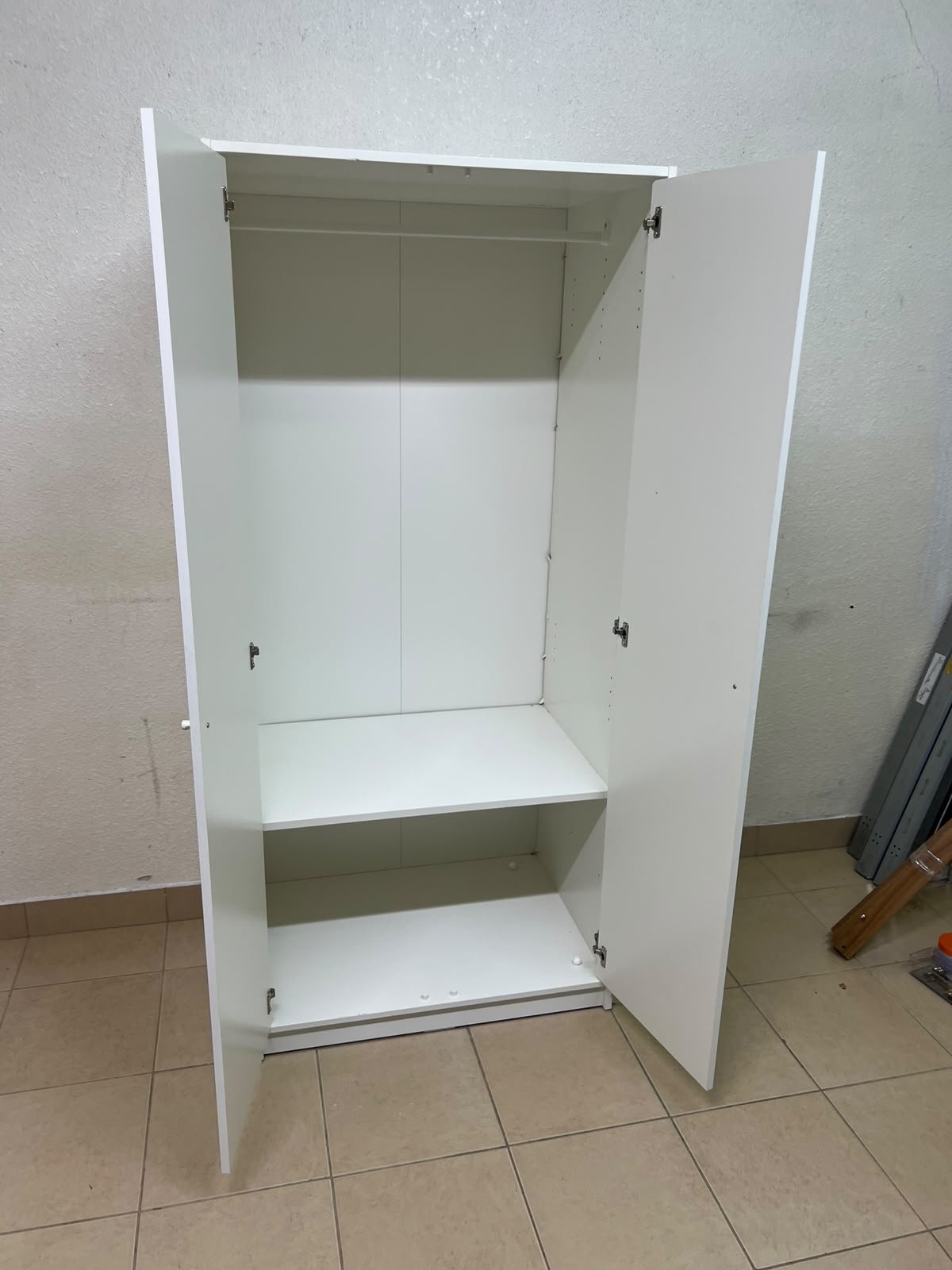 The IKEA KLEPPSTAD white two-door wardrobe features a simple design with two round handles and dimensions of 79x55x176 cm. - Image 2
