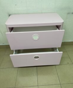 The "Busunge" chest of drawers from IKEA comes in light pink and features distinctive, circular cut-out handles. - Image 6