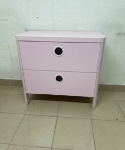 The "Busunge" chest of drawers from IKEA comes in light pink and features distinctive, circular cut-out handles. - Image 7