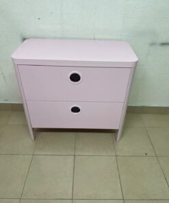 The "Busunge" chest of drawers from IKEA comes in light pink and features distinctive, circular cut-out handles. - Image 8