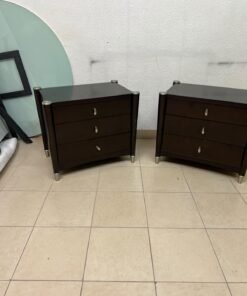 A pair of modern dark-wood bedside cabinets featuring three drawers, curved fronts, silver-colored handles, and elegant metal legs. - Image 7