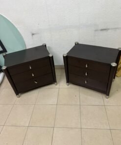 A pair of modern dark-wood bedside cabinets featuring three drawers, curved fronts, silver-colored handles, and elegant metal legs. - Image 9