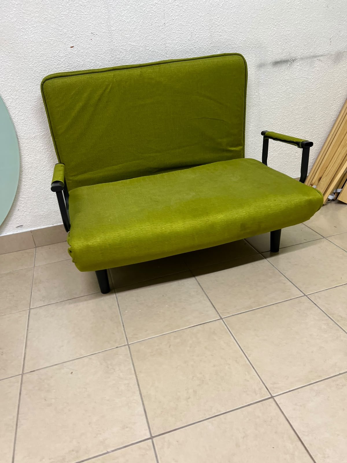 A multifunctional, foldable green sofa bed featuring black metal armrests and an adjustable backrest. - Image 2