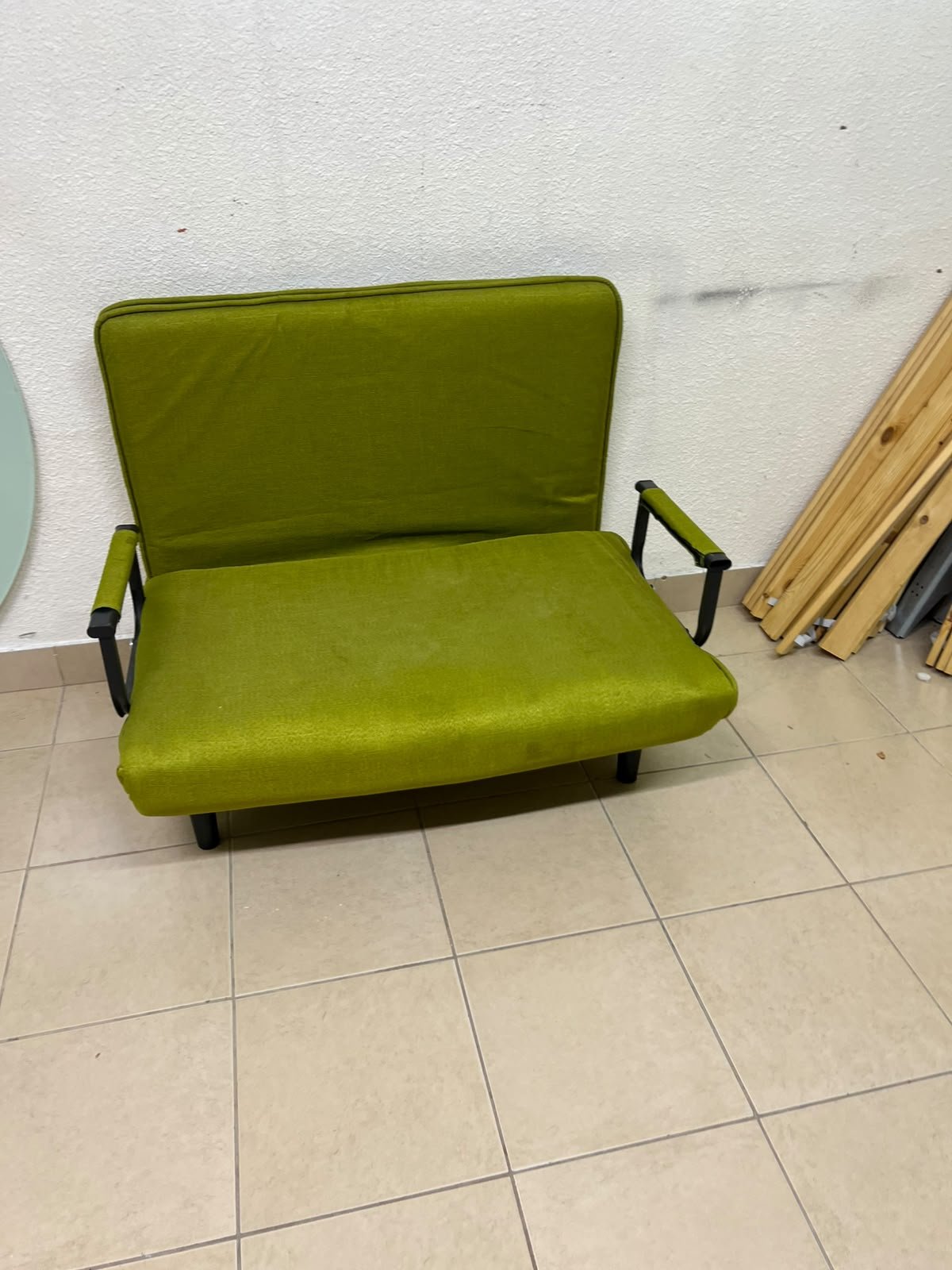 A multifunctional, foldable green sofa bed featuring black metal armrests and an adjustable backrest. - Image 10