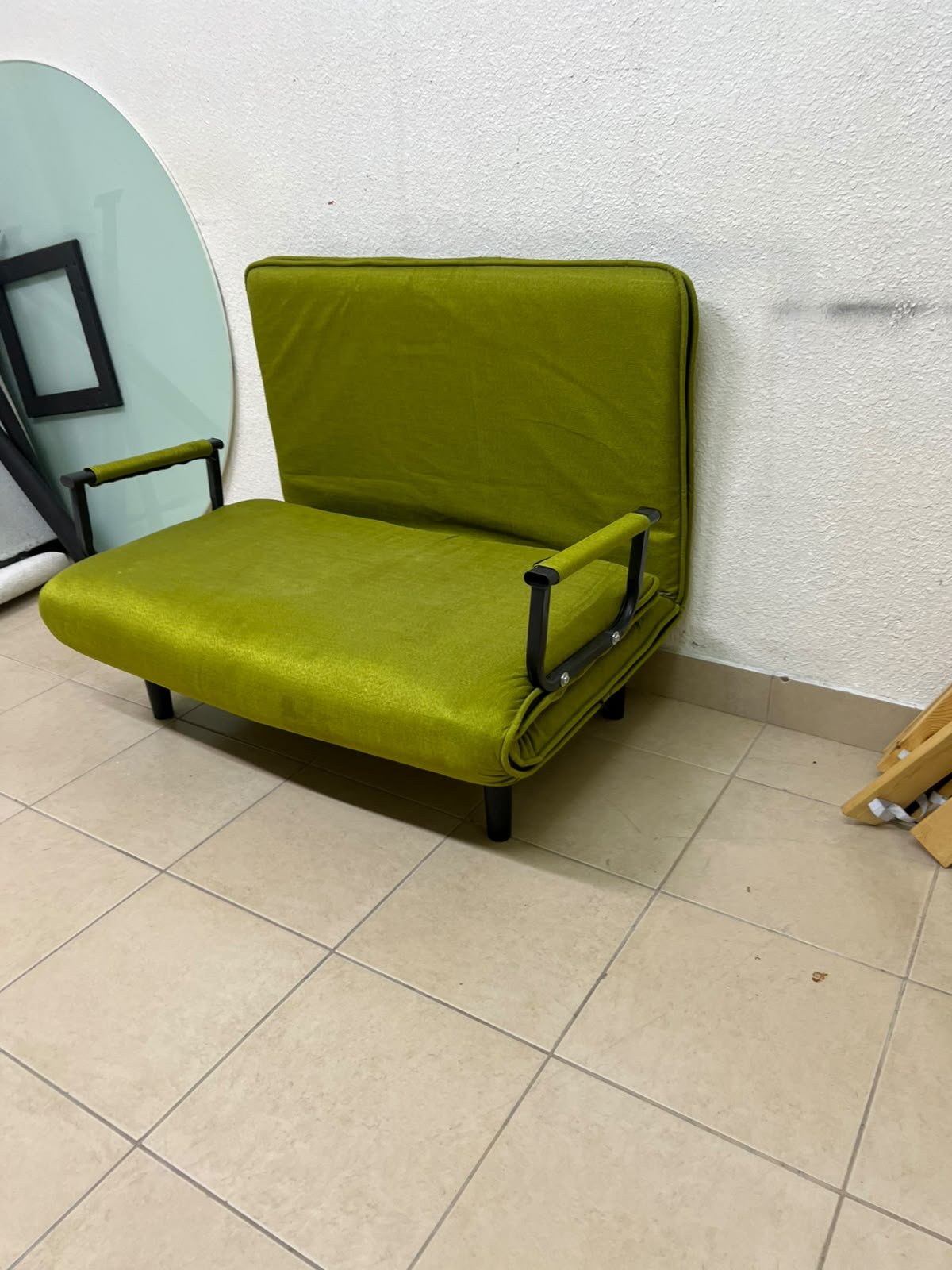 A multifunctional, foldable green sofa bed featuring black metal armrests and an adjustable backrest. - Image 11