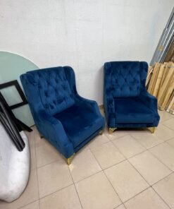 Wingback chairs upholstered in blue velvet, featuring ornate gold-finished metal legs. - Image 2