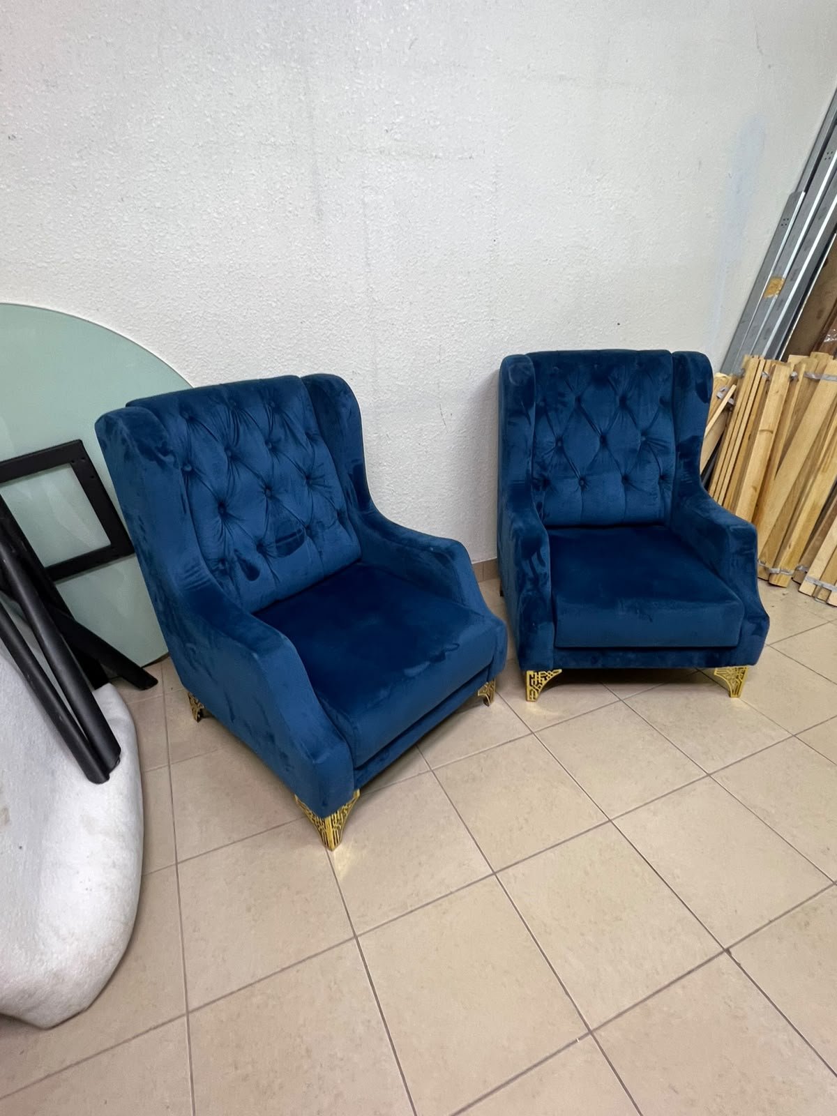 Wingback chairs upholstered in blue velvet, featuring ornate gold-finished metal legs. - Image 2