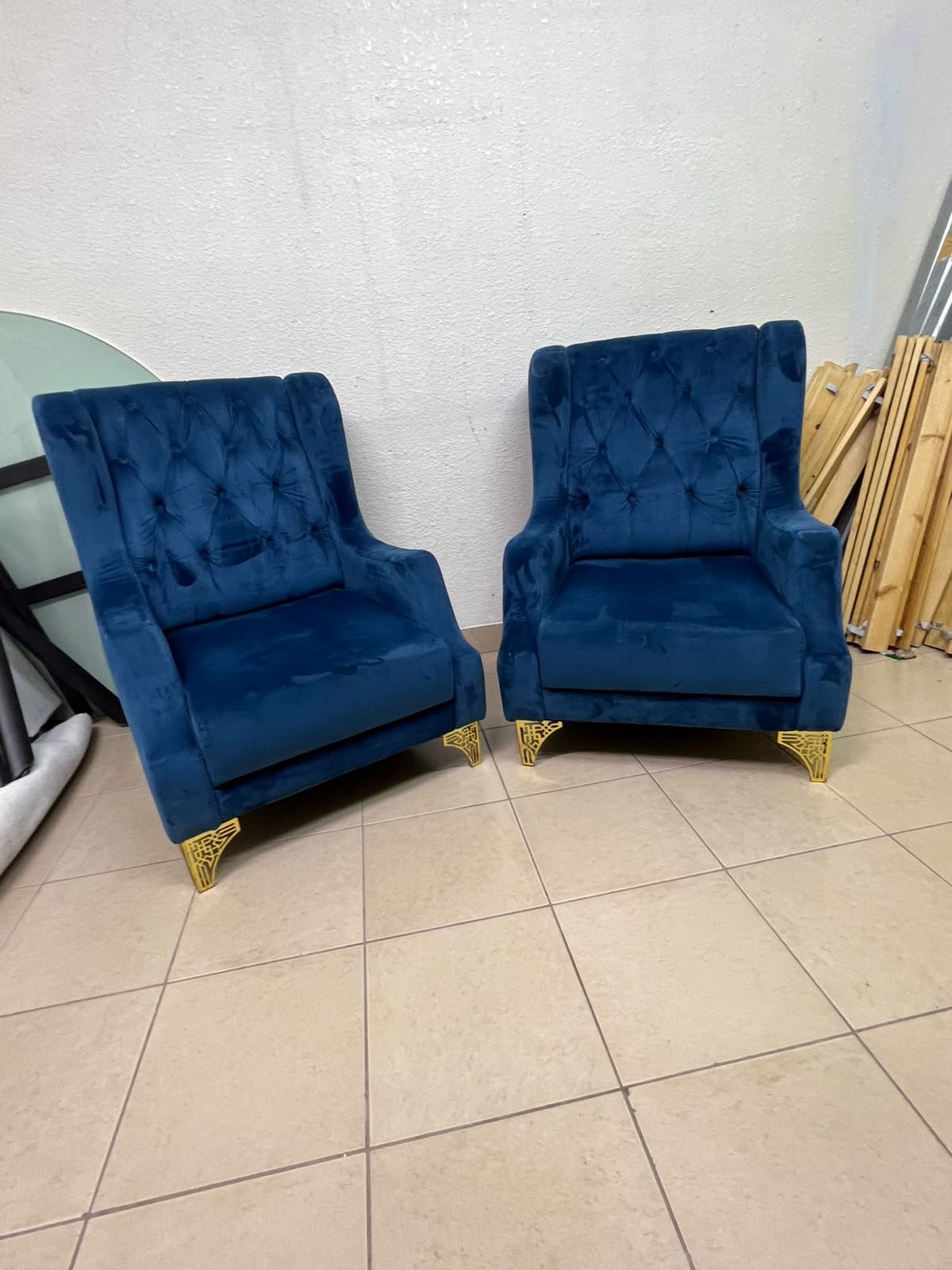 Wingback chairs upholstered in blue velvet, featuring ornate gold-finished metal legs. - Image 3