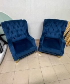 Wingback chairs upholstered in blue velvet, featuring ornate gold-finished metal legs. - Image 5