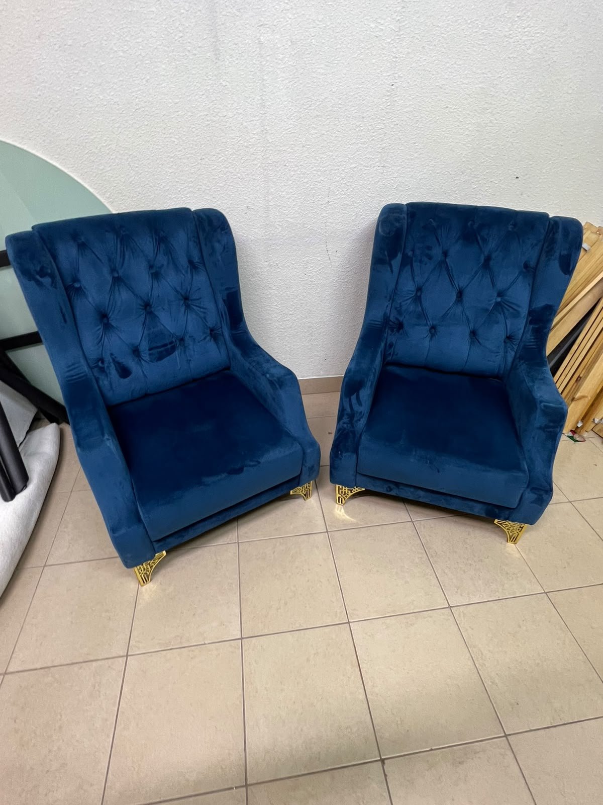 Wingback chairs upholstered in blue velvet, featuring ornate gold-finished metal legs. - Image 5