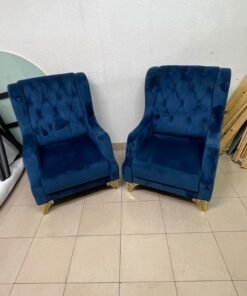 Wingback chairs upholstered in blue velvet, featuring ornate gold-finished metal legs. - Image 7
