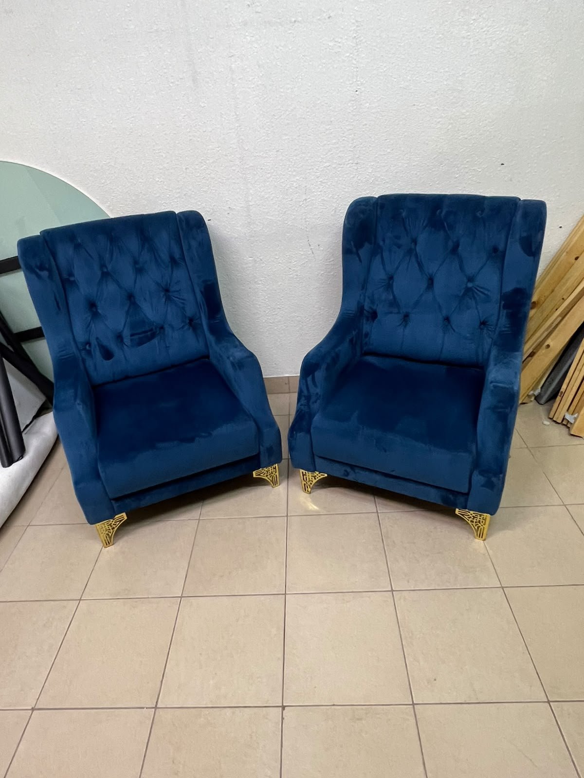 Wingback chairs upholstered in blue velvet, featuring ornate gold-finished metal legs. - Image 7