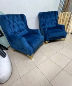 Wingback chairs upholstered in blue velvet, featuring ornate gold-finished metal legs. - Image 8