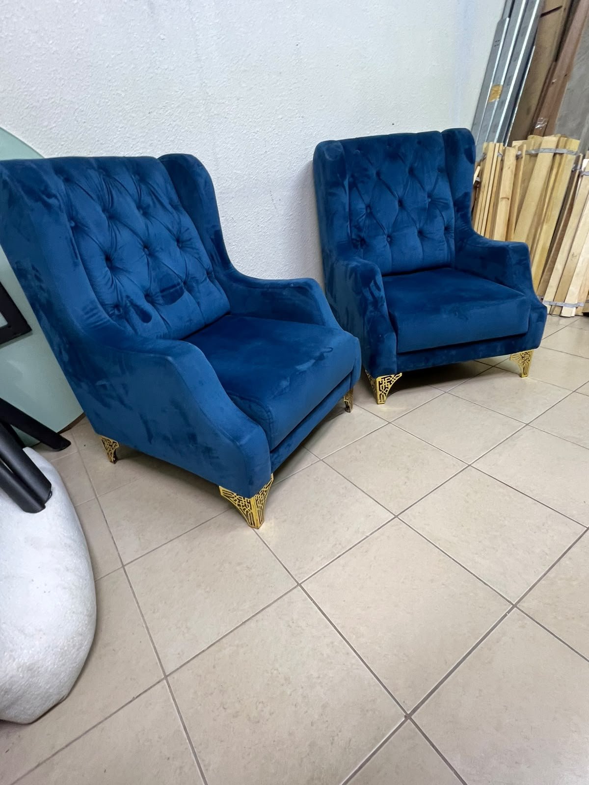 Wingback chairs upholstered in blue velvet, featuring ornate gold-finished metal legs. - Image 8