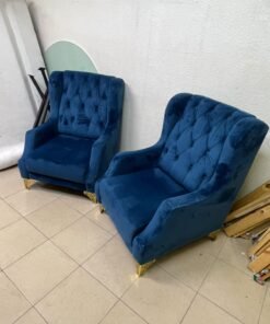 Wingback chairs upholstered in blue velvet, featuring ornate gold-finished metal legs. - Image 9