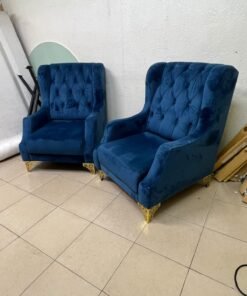 Wingback chairs upholstered in blue velvet, featuring ornate gold-finished metal legs. - Image 10