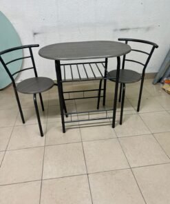 Two chairs and a table featuring an oval grey tabletop, a black tubular steel frame, and built-in storage shelves. - Image 2