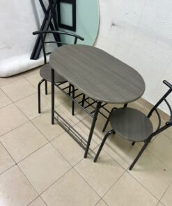 Two chairs and a table featuring an oval grey tabletop, a black tubular steel frame, and built-in storage shelves. - Image 3