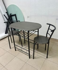 Two chairs and a table featuring an oval grey tabletop, a black tubular steel frame, and built-in storage shelves. - Image 4