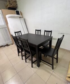 A dark solid wood dining table with matching slat-back chairs, featuring the design of the "Nordviken" collection from IKEA. - Image 2