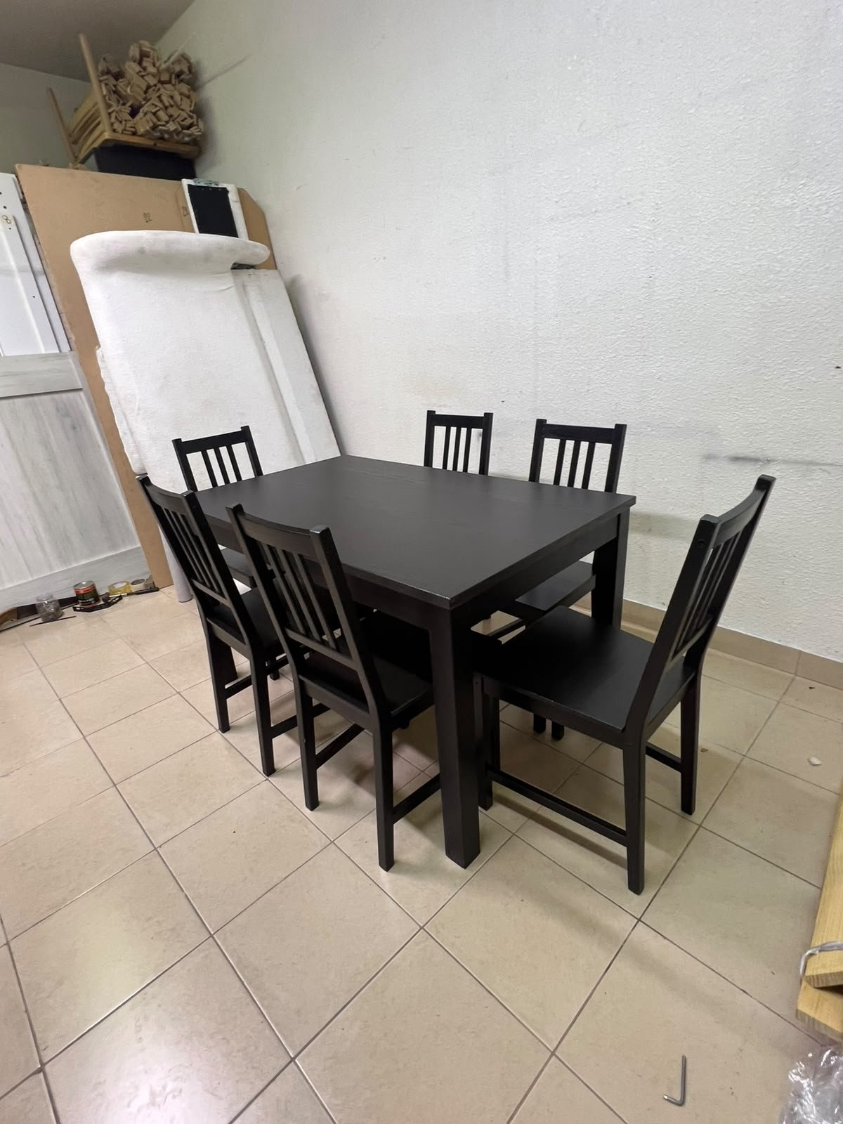 A dark solid wood dining table with matching slat-back chairs, featuring the design of the "Nordviken" collection from IKEA. - Image 2