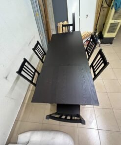 A dark solid wood dining table with matching slat-back chairs, featuring the design of the "Nordviken" collection from IKEA. - Image 5