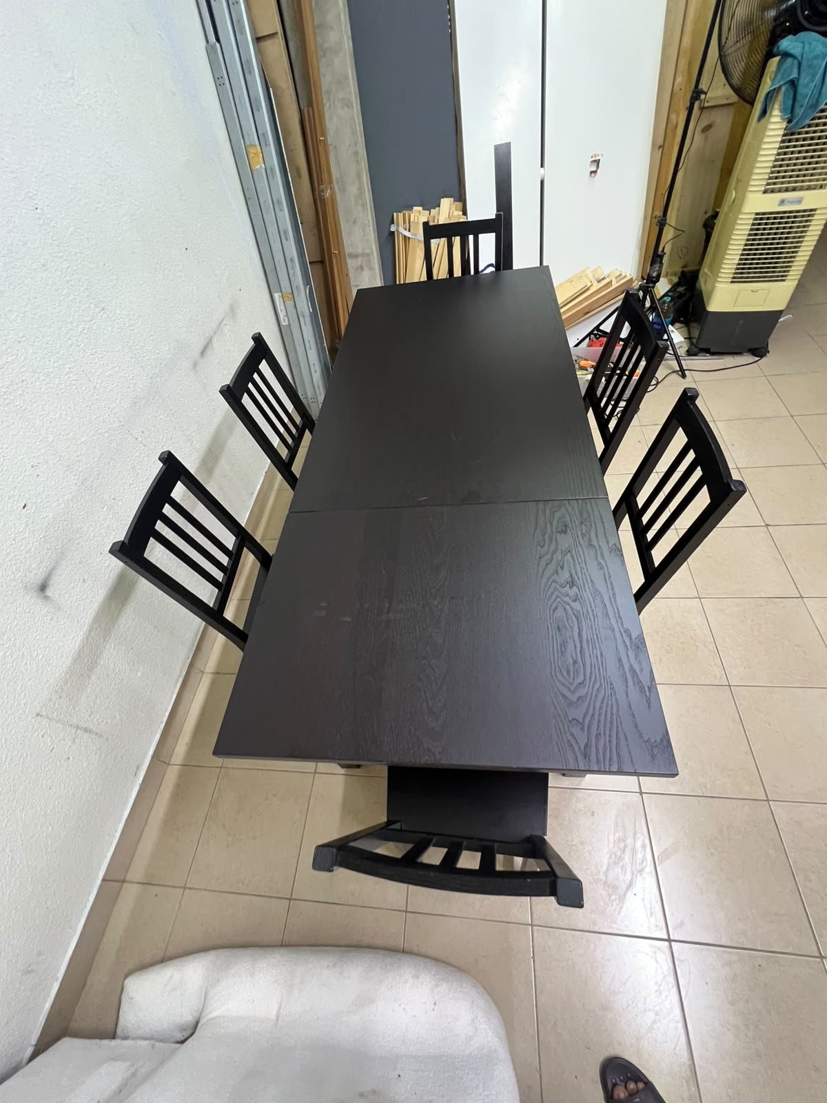 A dark solid wood dining table with matching slat-back chairs, featuring the design of the "Nordviken" collection from IKEA. - Image 5