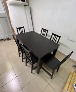 A dark solid wood dining table with matching slat-back chairs, featuring the design of the "Nordviken" collection from IKEA. - Image 6