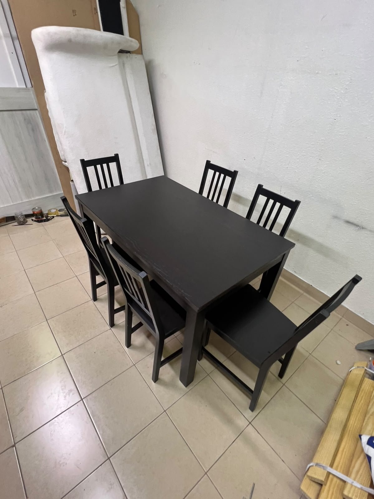 A dark solid wood dining table with matching slat-back chairs, featuring the design of the "Nordviken" collection from IKEA. - Image 6
