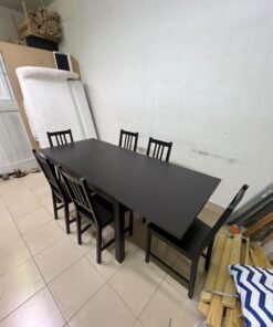 A dark solid wood dining table with matching slat-back chairs, featuring the design of the "Nordviken" collection from IKEA. - Image 7